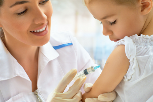 doctor giving a patient the flu shot