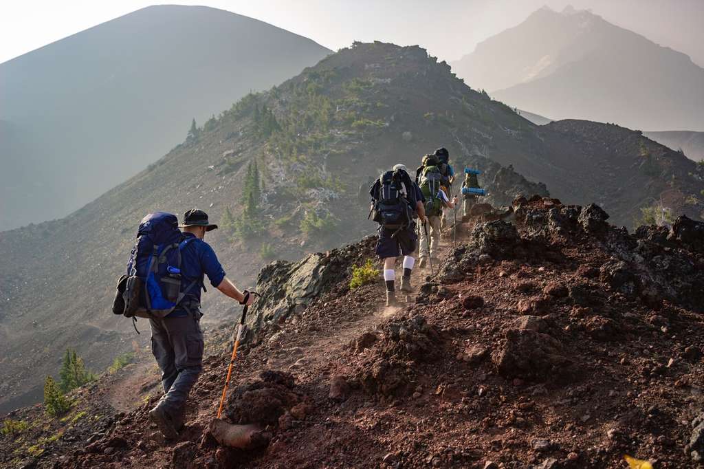 mountain climbers climbing to a higher altitude