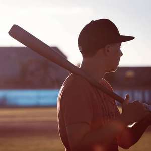 boy holding baseball bat
