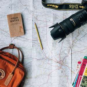 camera, map, pen, travel items
