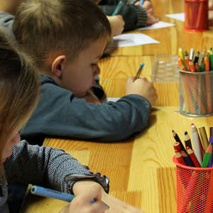 Kindergarteners working at a table