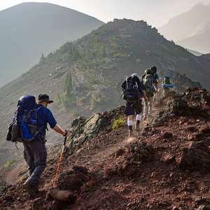 mountain climbers climbing to a higher altitude