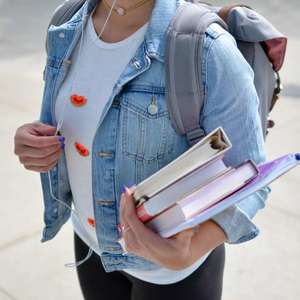 College student holding books