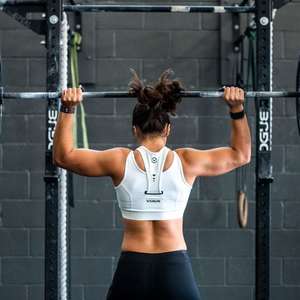 woman lifting barbell