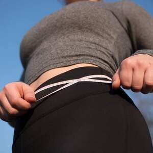 woman measuring waist