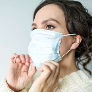 woman wearing white face mask