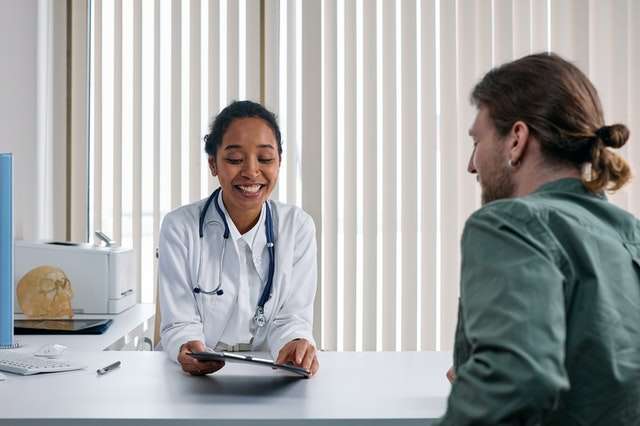 doctor doing immigration medical exam