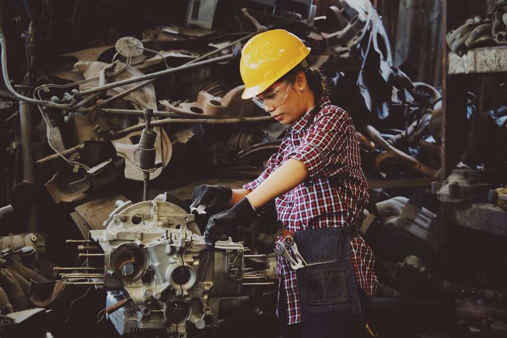 Factory worker using machine