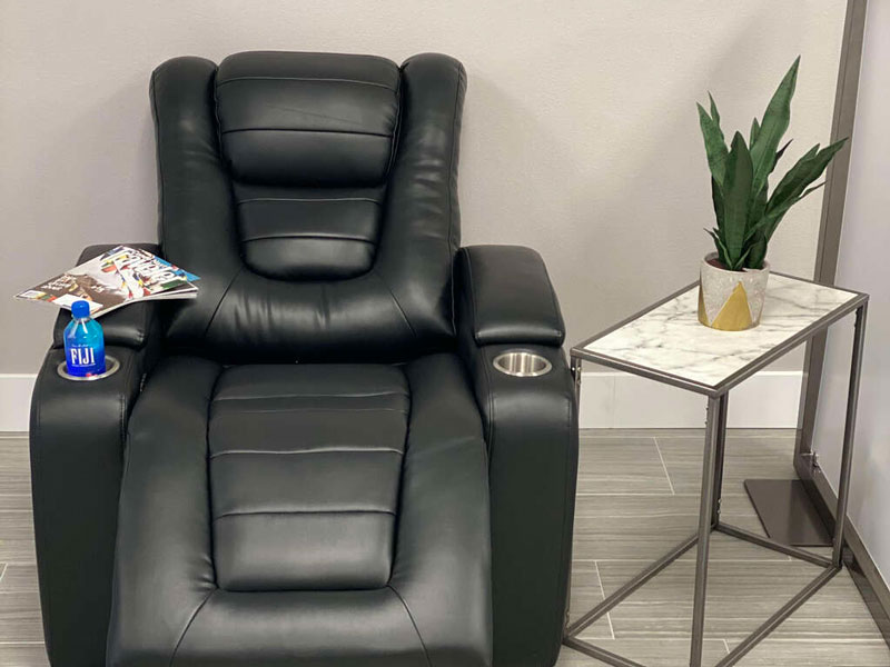 IV chair, relaxing recliner with magazine and bottled water