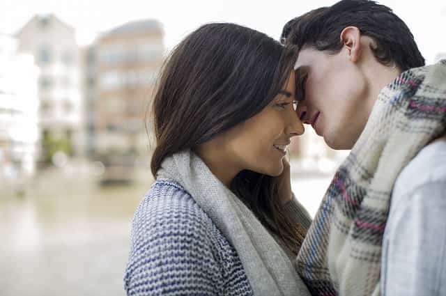 man and woman kissing