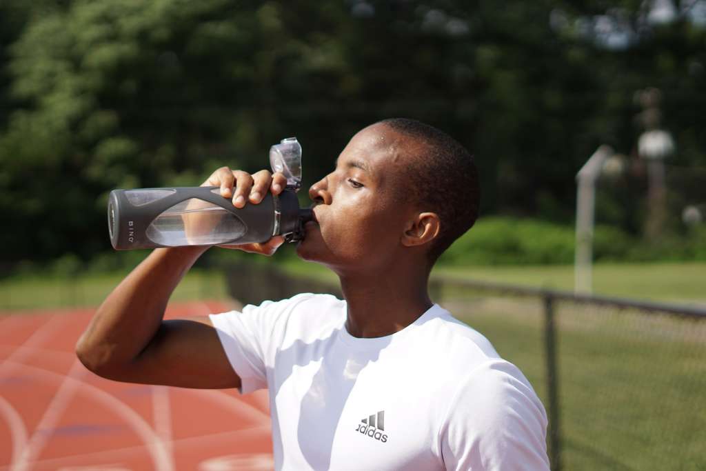 Man drinking water on running track in Las Vegas