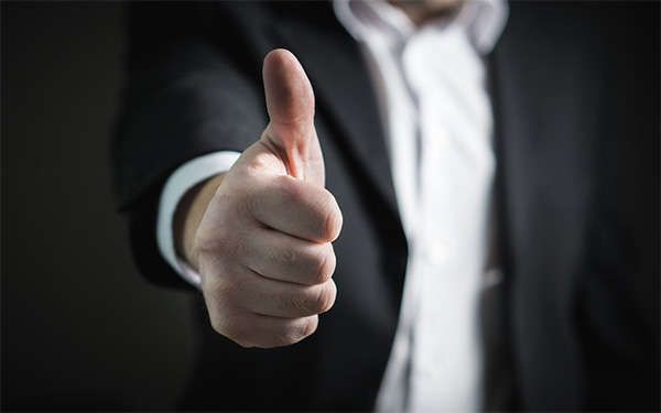 person holding thumbs up