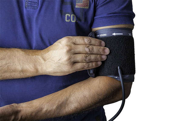 person wearing blood pressure cuff