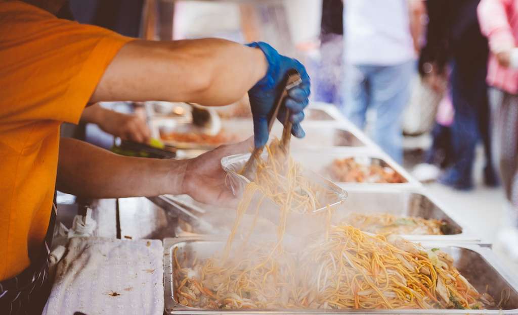 Vendor preparing street food