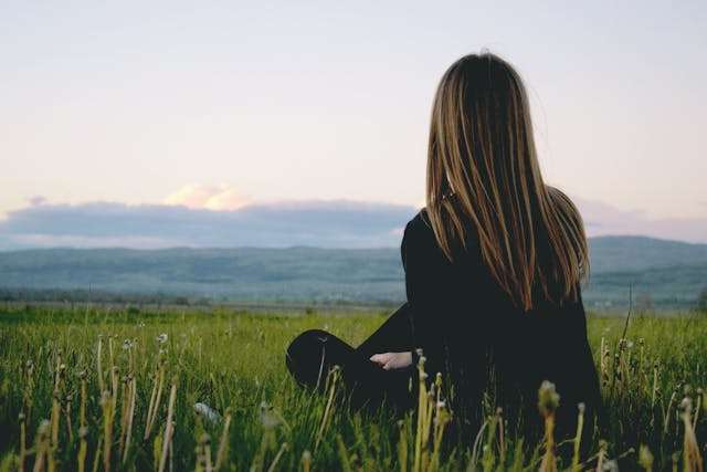Woman looking off at the mountains