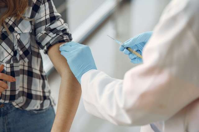 woman receiving vaccine